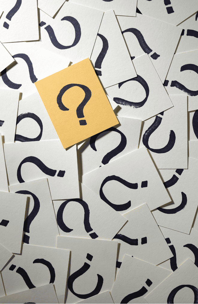 1 question mark on an orange sticky note among lots of white sticky notes